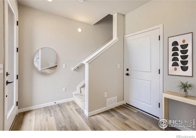 foyer entrance featuring light hardwood / wood-style flooring