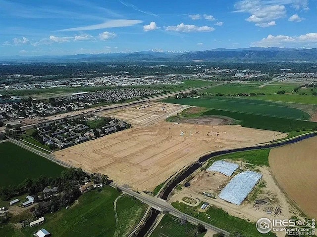 drone / aerial view featuring a mountain view