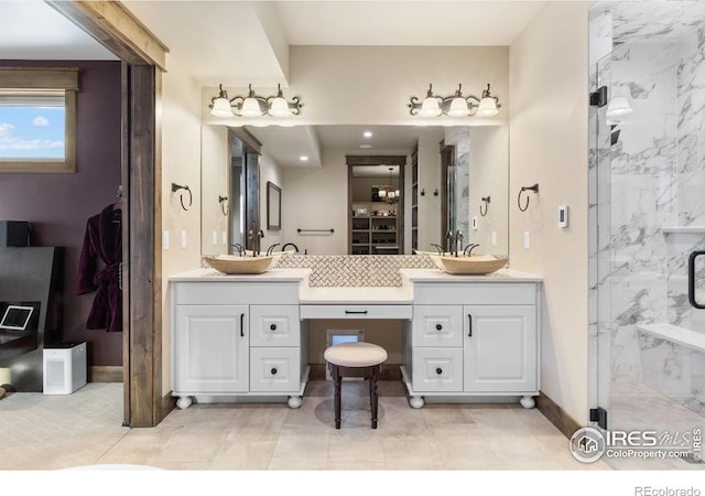 bathroom with vanity and an enclosed shower