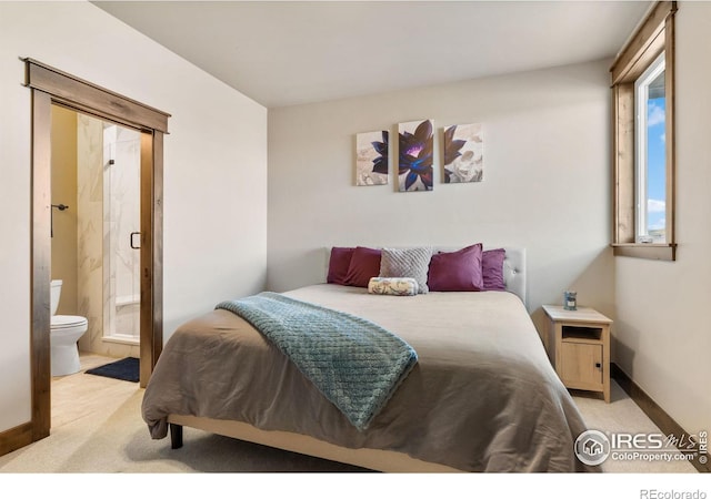 carpeted bedroom featuring connected bathroom