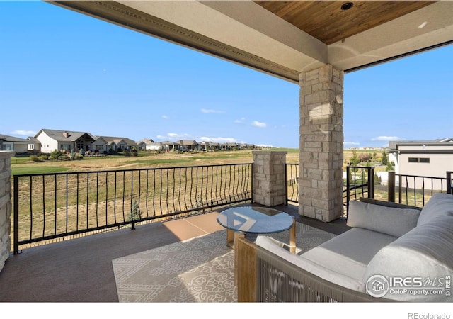 view of patio with a balcony