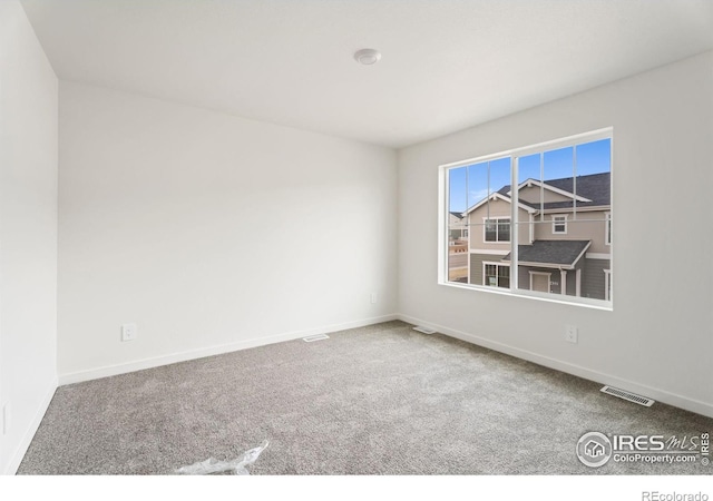 unfurnished room with carpet