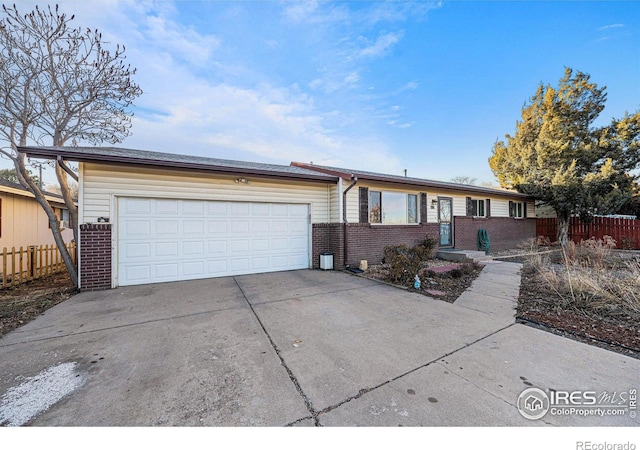 ranch-style house featuring a garage