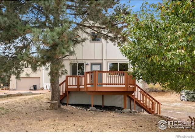 rear view of property with a wooden deck