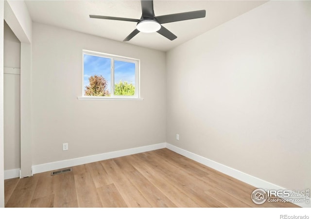 unfurnished room with ceiling fan and light hardwood / wood-style flooring