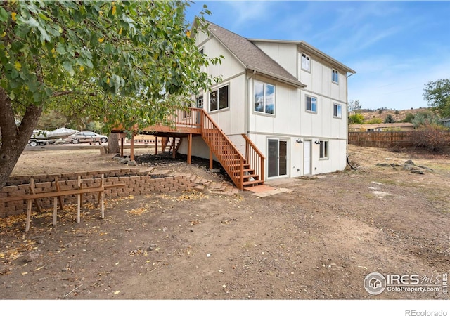 rear view of house with a deck