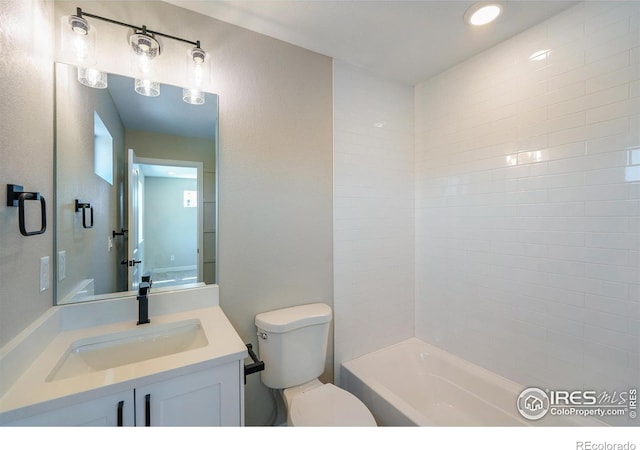 bathroom with toilet and vanity