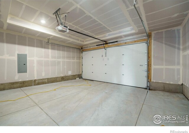 garage featuring a garage door opener and electric panel