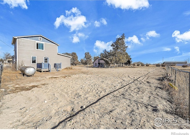 view of yard featuring a wooden deck