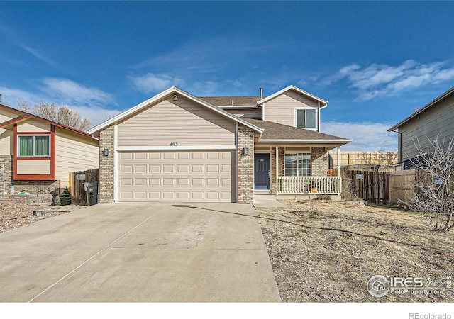 view of front of home with a porch and a garage