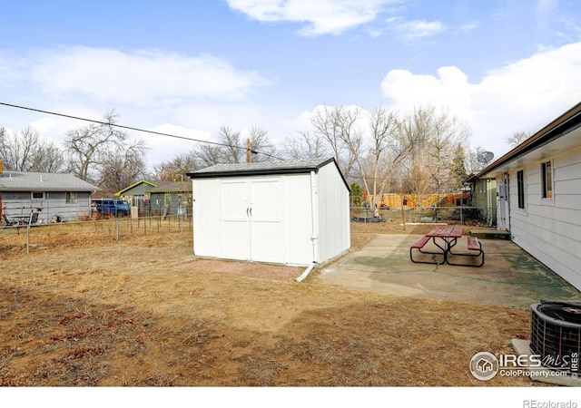 view of yard with a storage unit and cooling unit