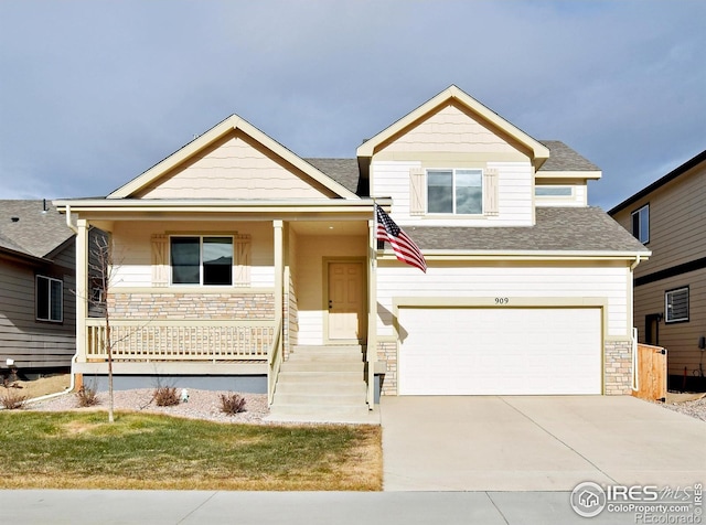 view of front of property with a garage and a porch