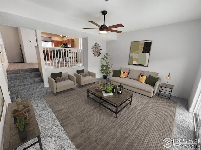 carpeted living area with stairway, a ceiling fan, and baseboards