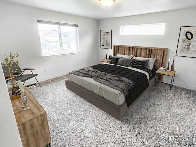 bedroom featuring baseboards