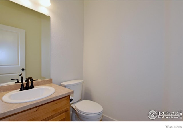 half bath with toilet and vanity