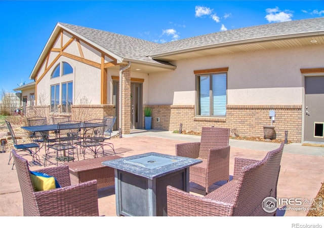 view of patio with an outdoor fire pit