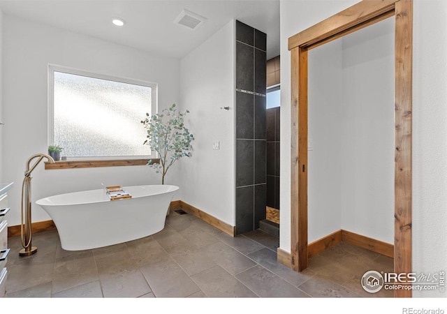 bathroom with shower with separate bathtub