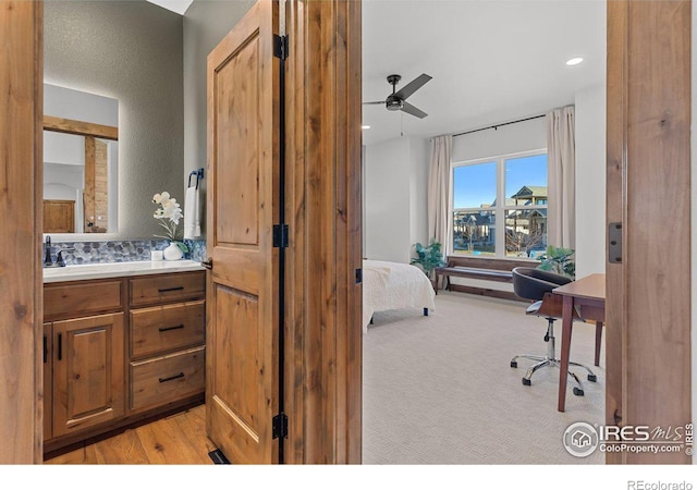 carpeted bedroom featuring ceiling fan