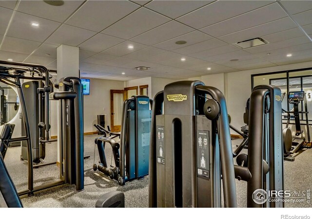 workout area featuring a paneled ceiling