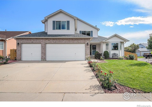 view of front of house featuring a front lawn and a garage