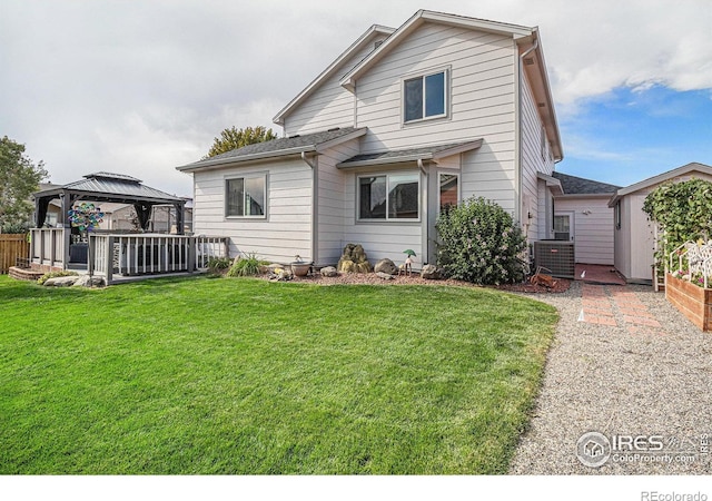 back of house with a gazebo, cooling unit, and a yard