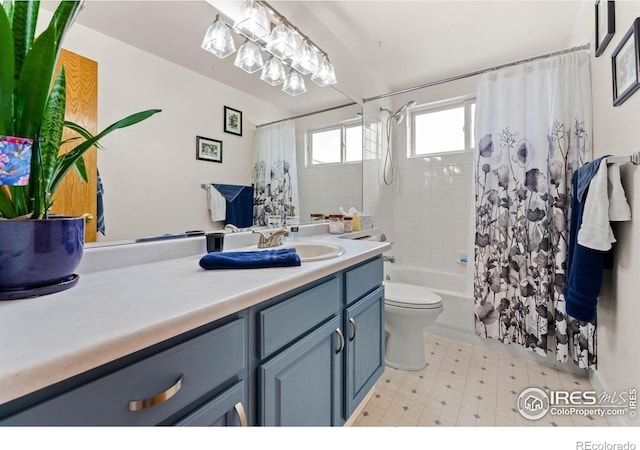 full bathroom with vanity, toilet, and shower / bath combo with shower curtain