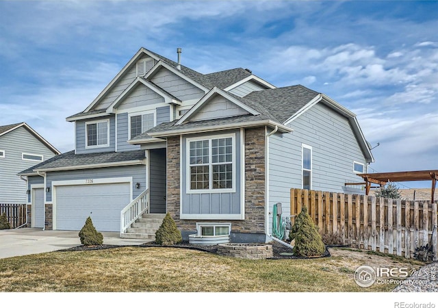 view of front of house with a front yard and a garage