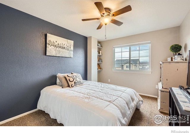 bedroom with dark colored carpet and ceiling fan