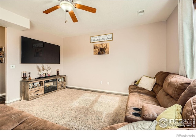 living room with carpet floors and ceiling fan