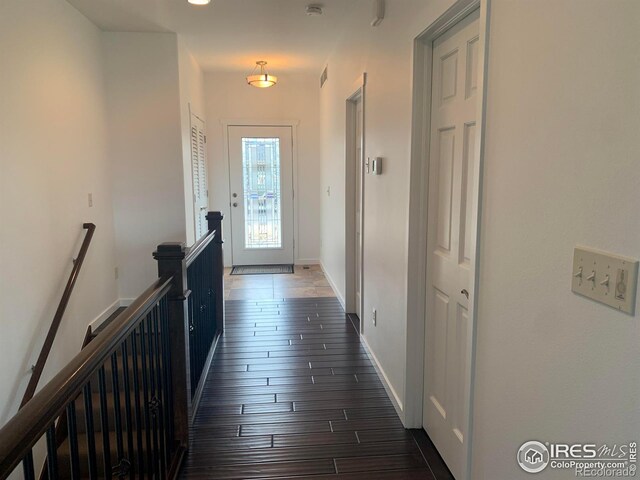 corridor with dark wood-type flooring