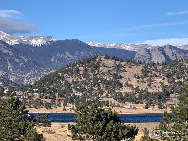 view of mountain feature with a water view