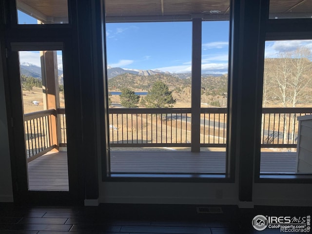 interior space featuring a mountain view and plenty of natural light