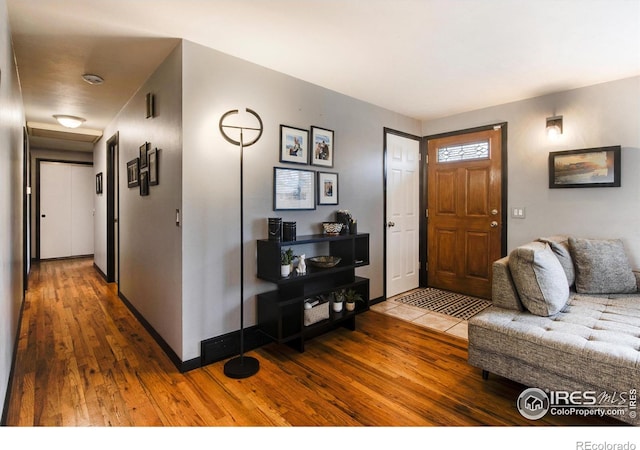 entryway with dark wood-type flooring