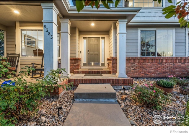 doorway to property with a porch