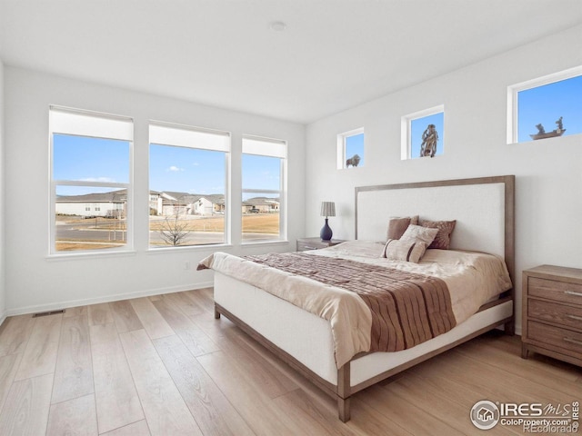 bedroom featuring light wood-type flooring