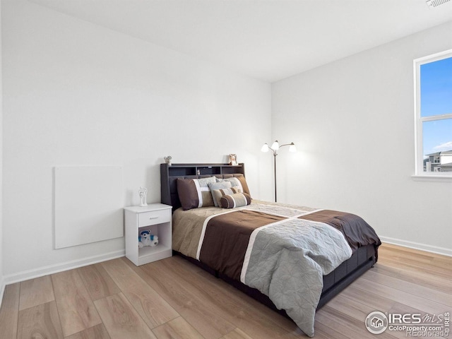 bedroom featuring light wood-type flooring