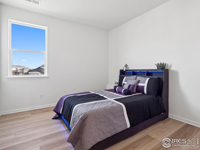 bedroom featuring light hardwood / wood-style floors