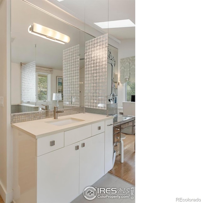 bathroom featuring vanity and wood finished floors