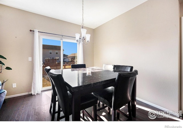 dining area with dark wood-style floors and baseboards