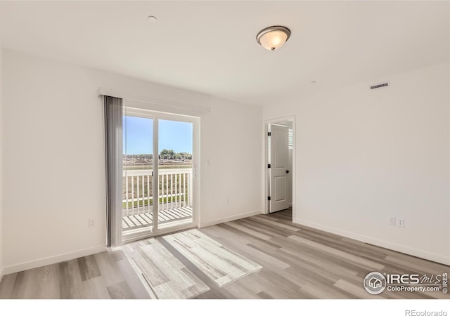 empty room with light wood-type flooring