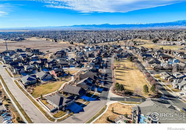 birds eye view of property with a mountain view