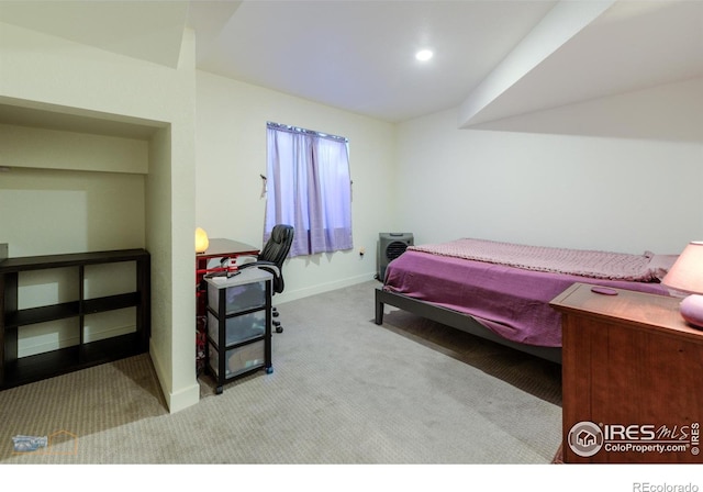 bedroom with carpet and baseboards