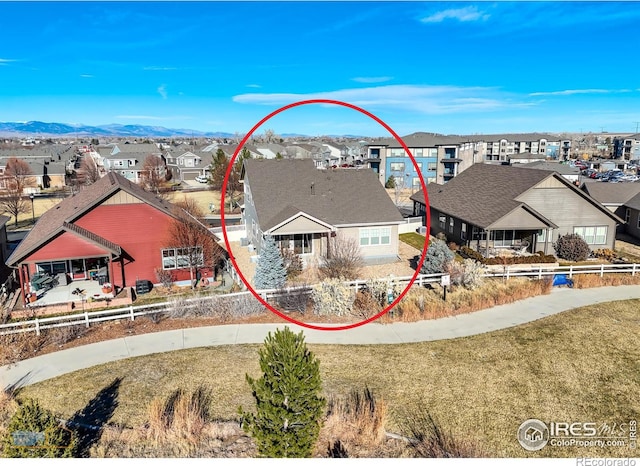birds eye view of property with a residential view