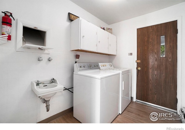 laundry area featuring dark wood-type flooring and washer and dryer