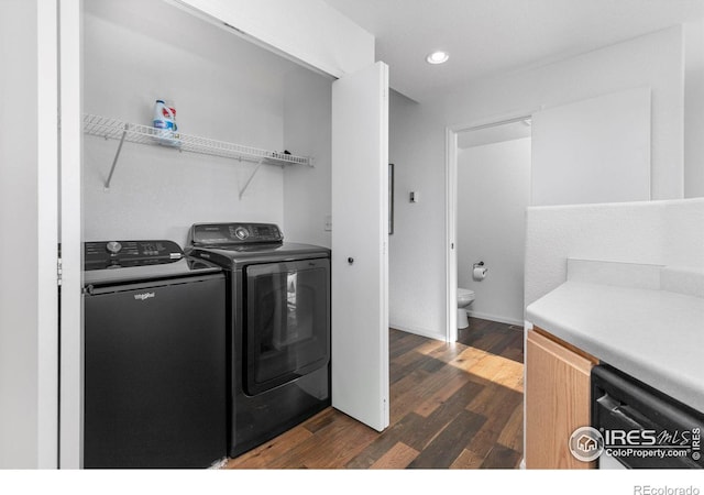 laundry area with dark wood-style floors, recessed lighting, laundry area, and washer and clothes dryer