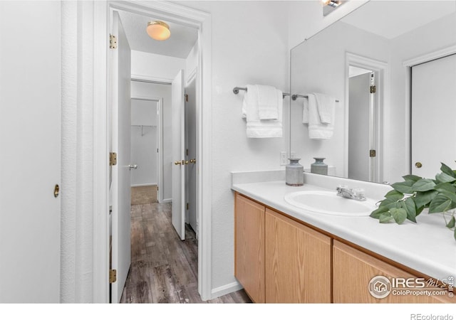 bathroom featuring vanity and wood finished floors