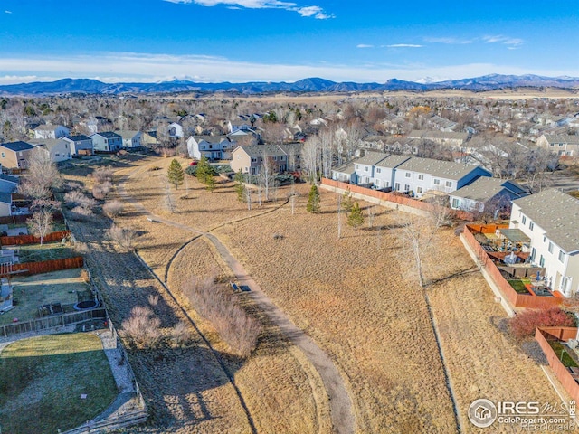 birds eye view of property with a mountain view and a residential view