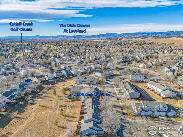 birds eye view of property with a residential view and a mountain view