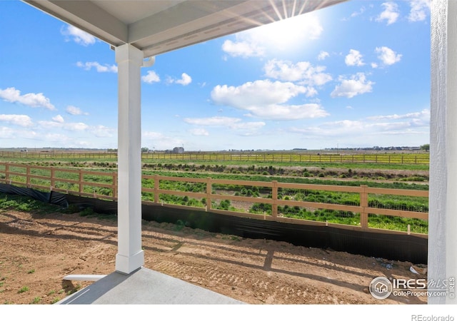 view of yard with a rural view