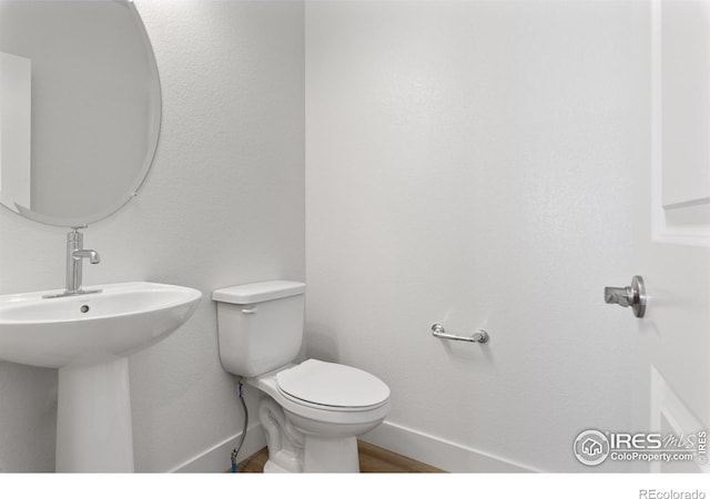 bathroom with toilet and sink